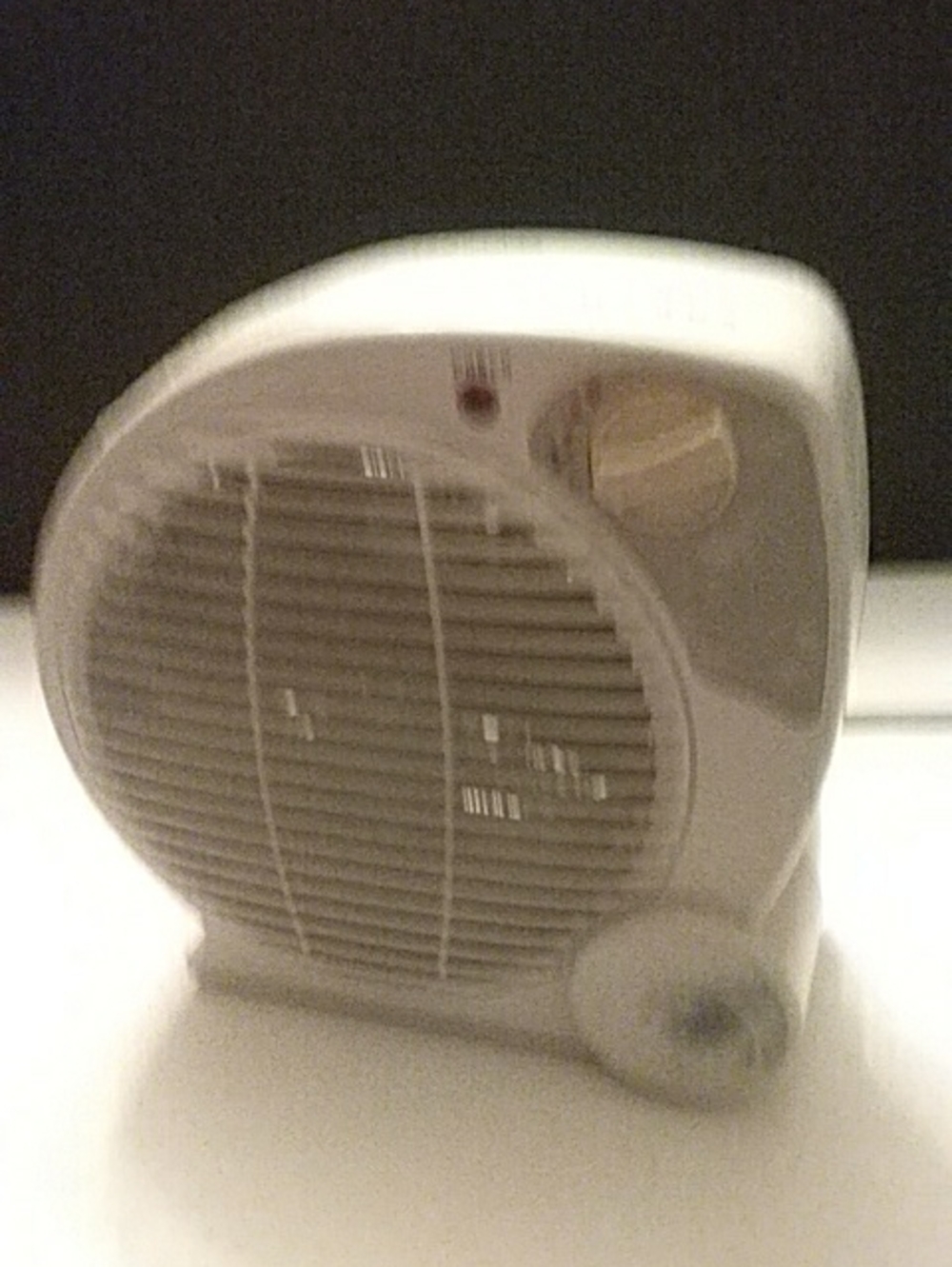 Compact White Portable Heater with Front Grille